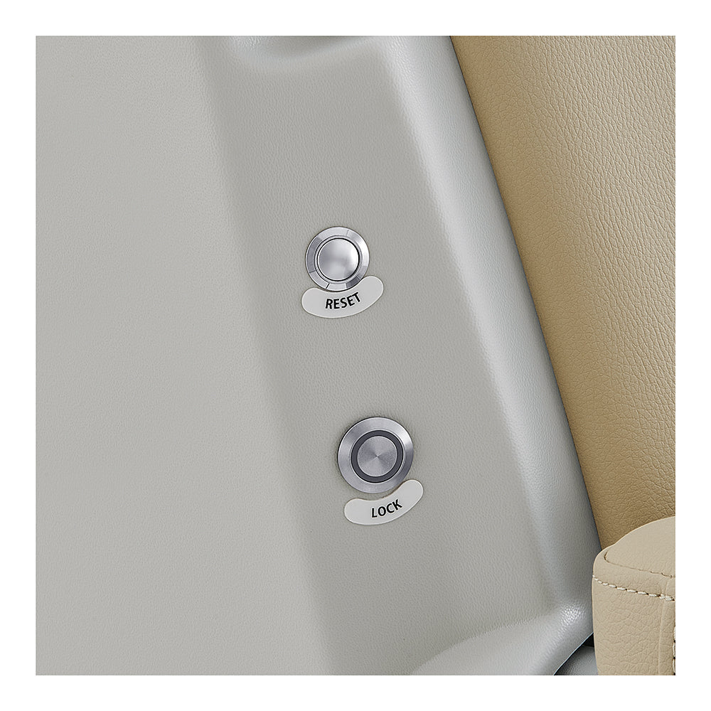 Close-up of Sydney medical chair with 'Lock' and 'Reset' buttons on a beige interior background.