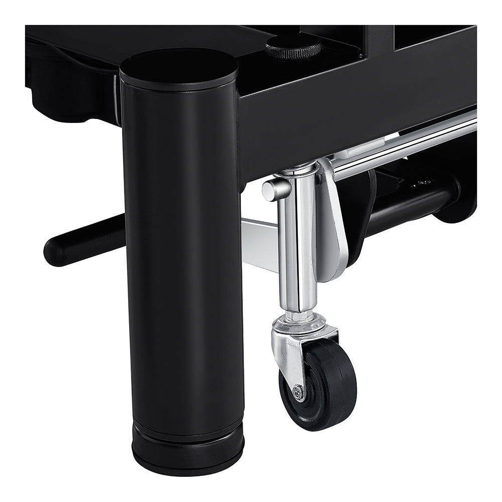 Close-up of a black leg with a silver caster on the DIR WellRelax Treatment Table.
