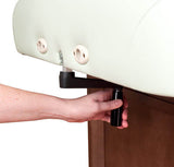 Adjusting the Oakworks CLINICIAN Manual-Hydraulic Flat Top table height with a black lever.