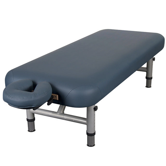 EarthLite YOSEMITE™ 30 blue massage table with face cradle and metal legs on white background.