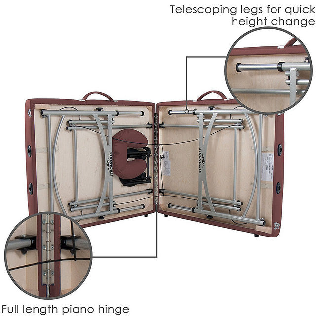 Stronglite VERSALITE Pro massage table with telescoping legs and a full-length piano hinge.