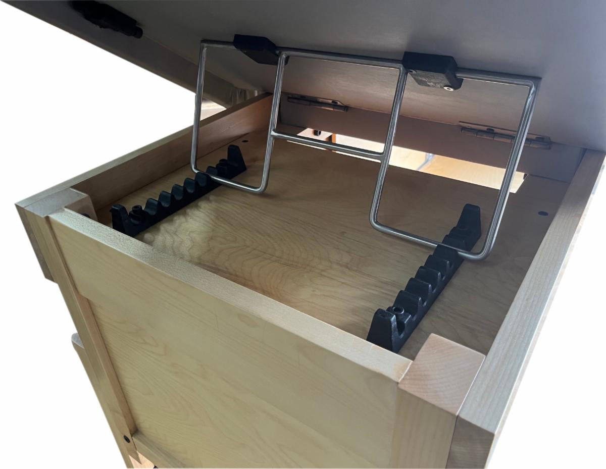 Open wood drawer with file organizers near a TouchAmerica SONDI Treatment Table.