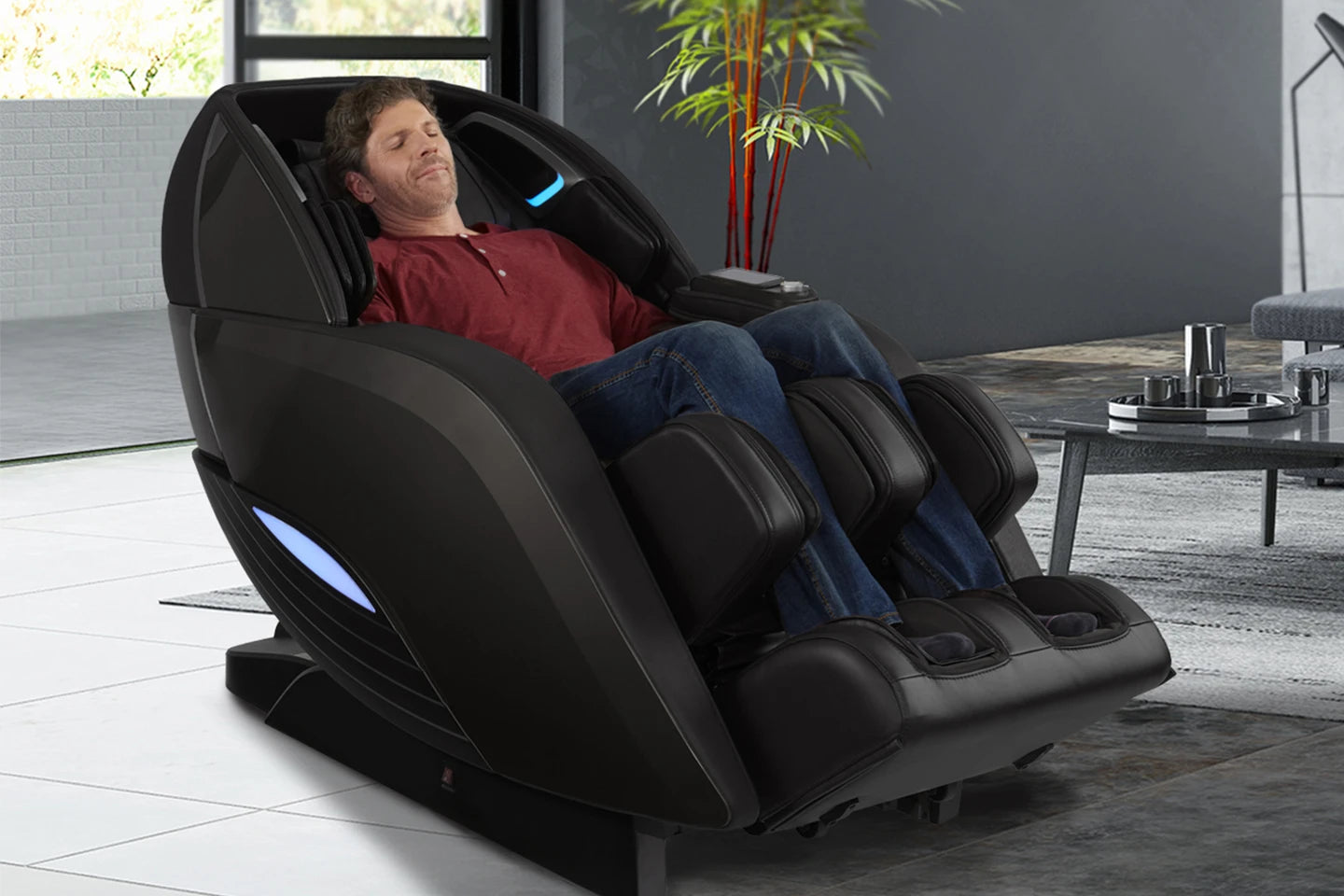 Man relaxing in a Kyota Yutaka™ M898 4D Electric Massage Chair with calf and foot massage.