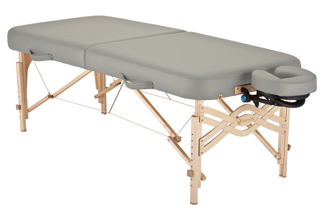 EarthLite SPIRIT Portable Massage Table with wooden legs and a face cradle.