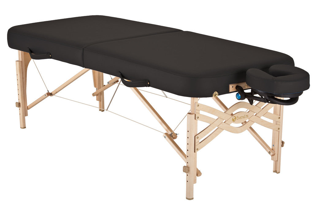 EarthLite SPIRIT portable massage table with wooden legs and adjustable face cradle.