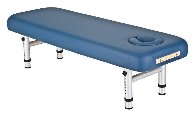 EarthLite YOSEMITE 25" Shiatsu Massage Table with adjustable legs and face hole, blue, angled view.
