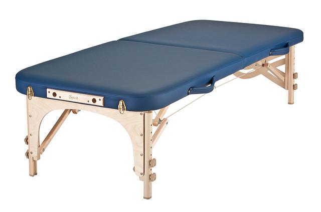 EarthLite SPIRIT FELDENKRAIS blue eco-friendly massage table with wood legs and side handles.