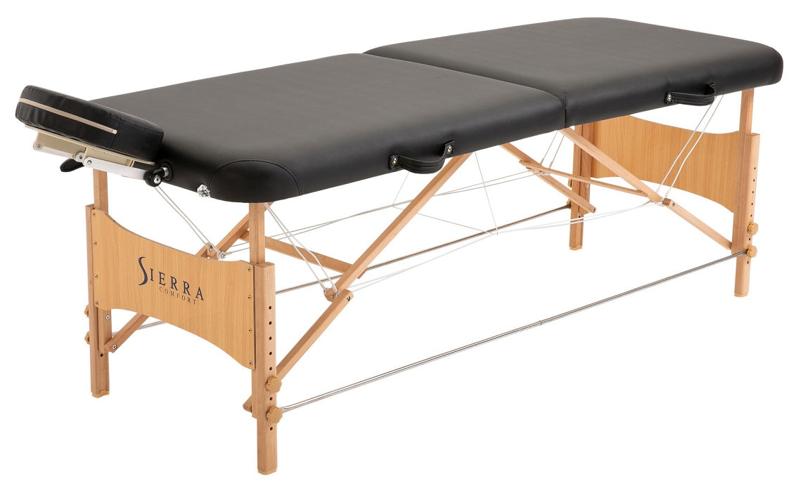 The Sierra Comfort ALL-INCLUSIVE black massage table features wood legs and a face cradle.