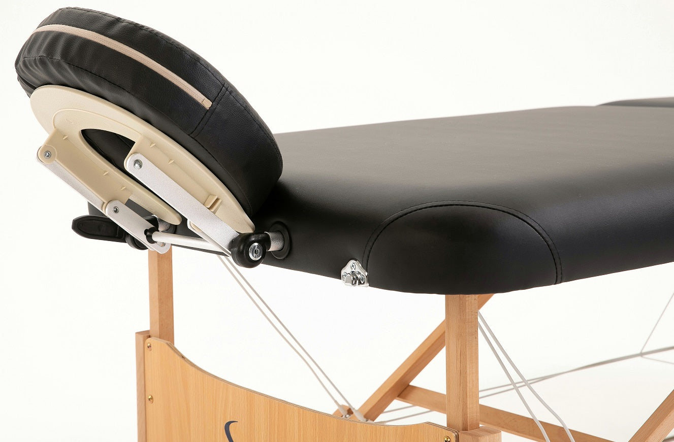 Sierra Comfort PREFERRED portable massage table with adjustable headrest and wooden legs.