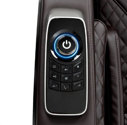 Close-up of Osaki OS-4D Pro Ekon Plus Massage Chair control panel on brown quilted surface.