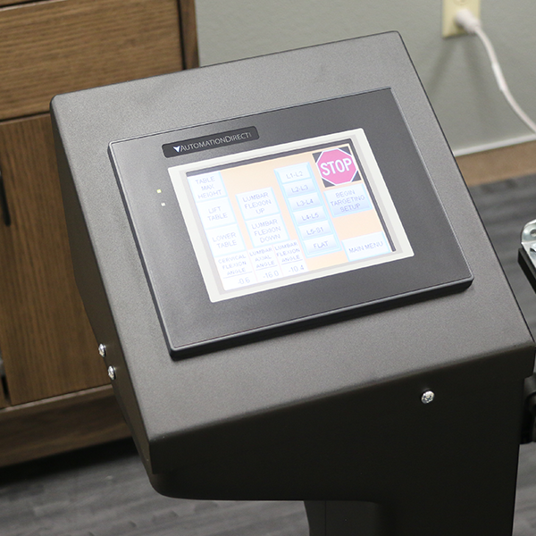 A black PHS Medical DOC Decompression Table digital machine with a screen.