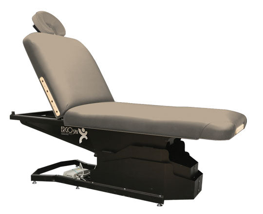 Custom Craftworks ERGOSPA LIFT BACK electric table, gray cushioned top, black base.