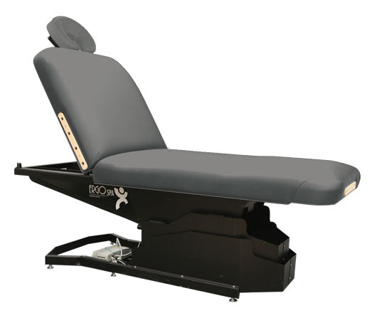 Custom Craftworks ERGOSPA LIFT BACK electric table with padded surface and adjustable face rest.