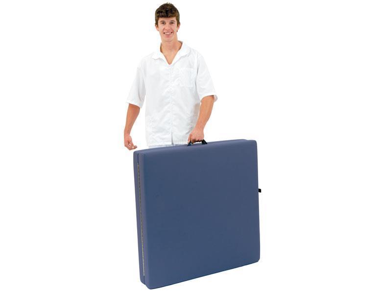 Person holding a Custom Craftworks Classic Feldenkrais Technique Table by its handle.