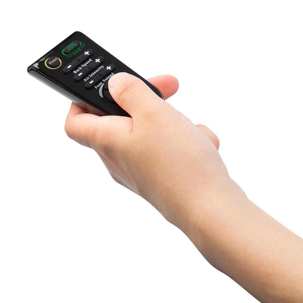 Hand holding a black Osaki remote for the Osaki OS-4000 Massage Chair against white background.