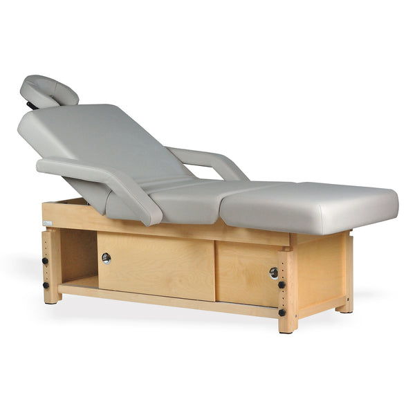 TouchAmerica SONDI Treatment Table with light wood base and padded gray cushioning.