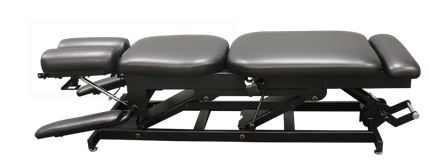 PHS Chiropractic ERGOBASIC table with manual pump elevation and padded pelvic drop.