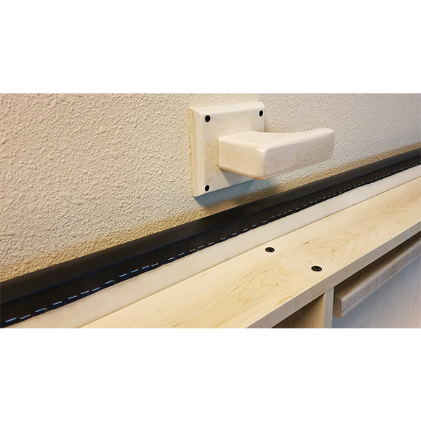 PHS Medical Wall Mount Folding Treatment Table with wall handrail bracket on beige wall.