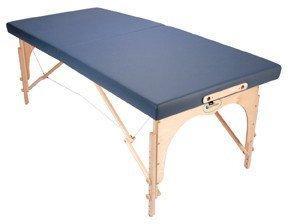 The Custom Craftworks ALEXANDER TECHNIQUE portable table features a blue padded top and wood legs.