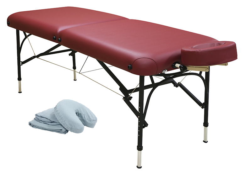 Custom Craftworks CHALLENGER red massage table, black legs, folded linens by headrest.
