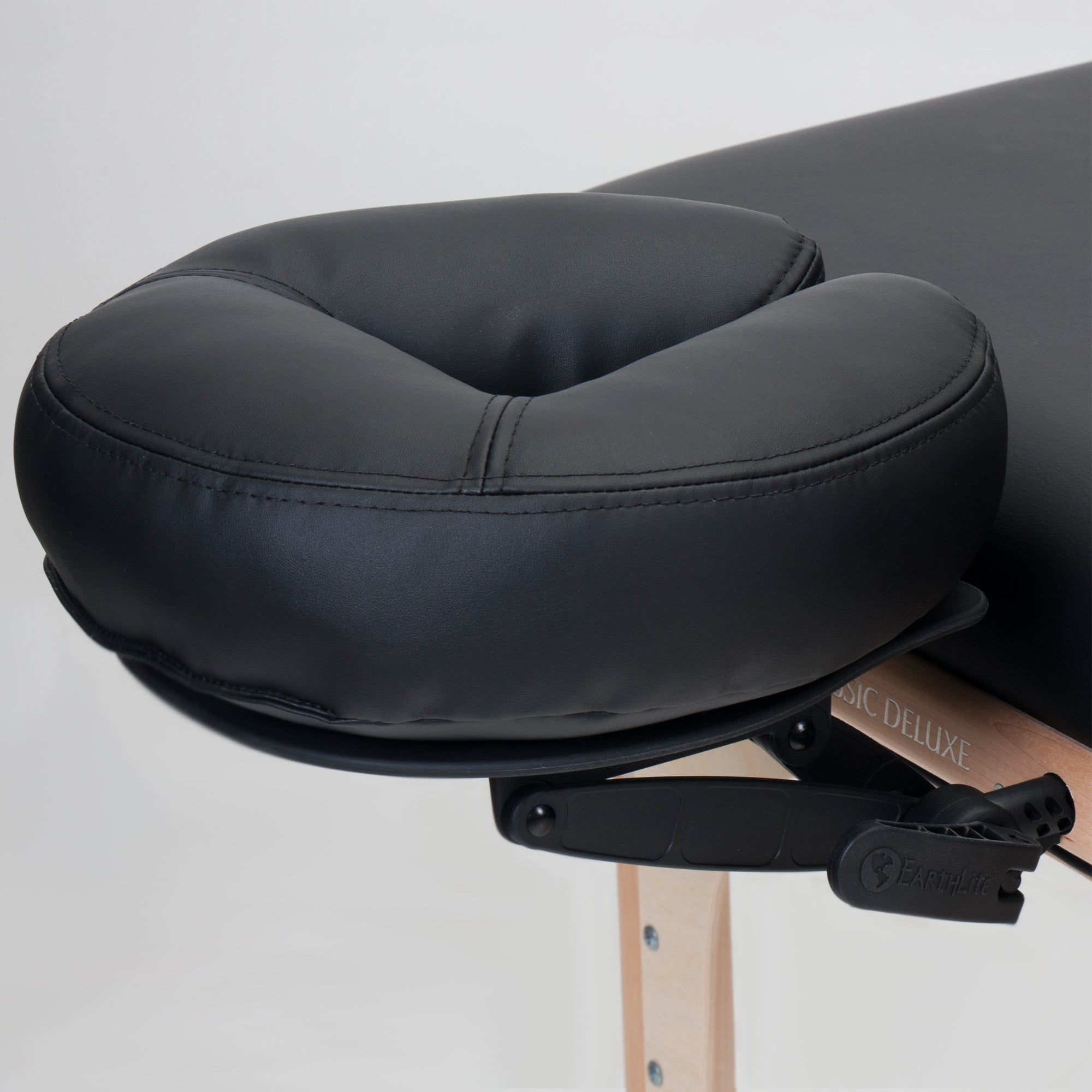 Stronglite CLASSIC DELUXE Table Package with a black adjustable headrest and wooden legs.