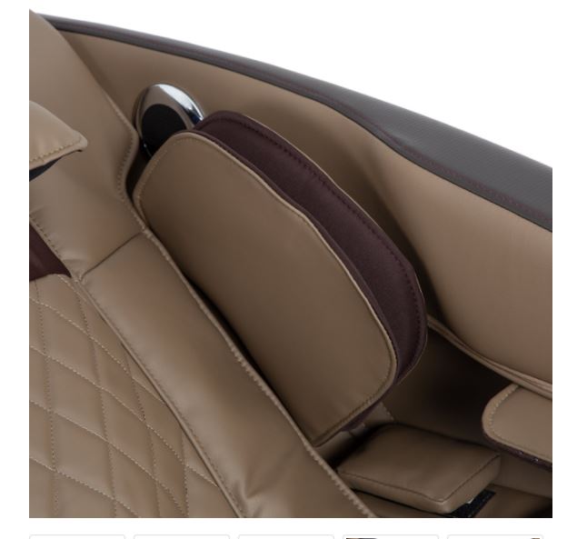 Close-up of Titan PRO COMMANDER brown leather seat with quilted stitching and adjustable armrest.