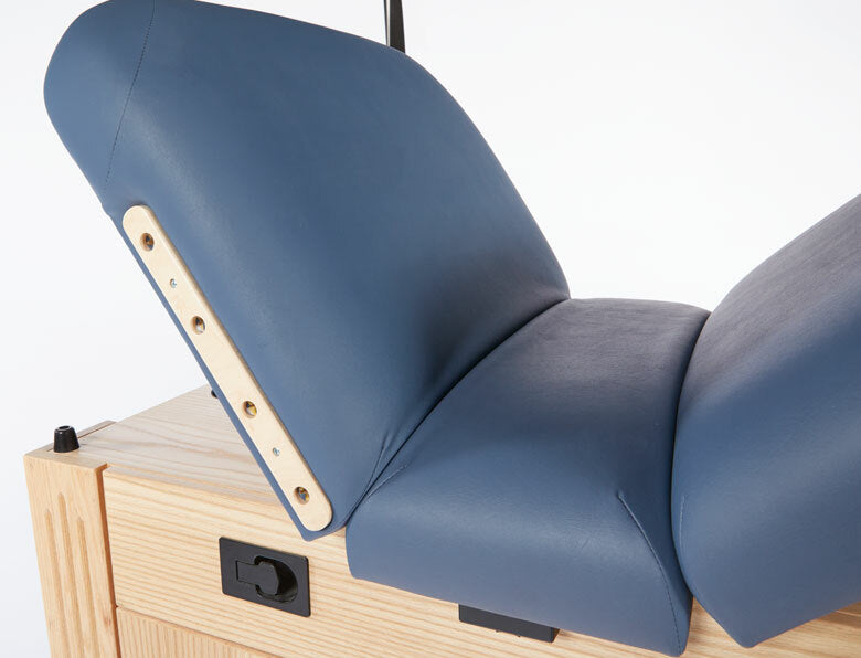 Custom Craftworks M100 Deluxe Electric Spa Table, adjustable blue padded wooden frame, reclined.