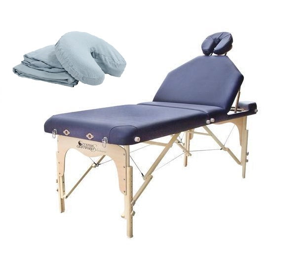 Custom Craftworks DESTINY Lift Back Massage Table with blue sheets and adjustable face rest.