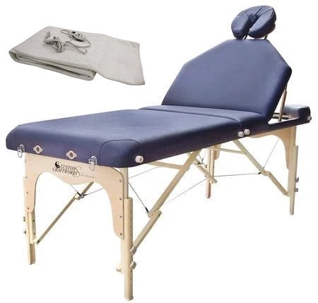 Custom Craftworks DESTINY Lift Back Massage Table with face rest and folded heating pad on side.