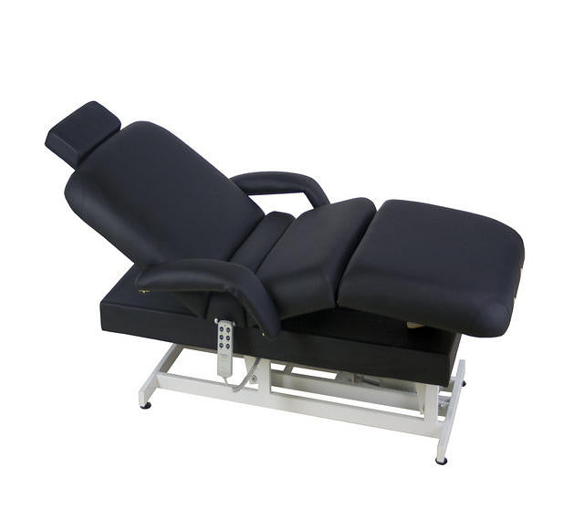 TouchAmerica HILO POWERTILT adjustable massage table with headrest and armrests, white background.