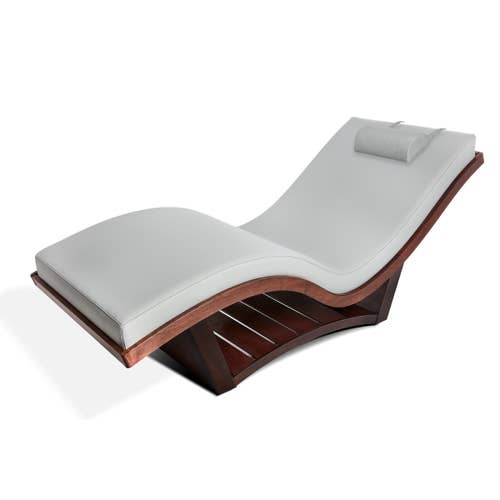 Living Earth Crafts NuWave S™ Lounger: Modern white chair with curved wood base and headrest.