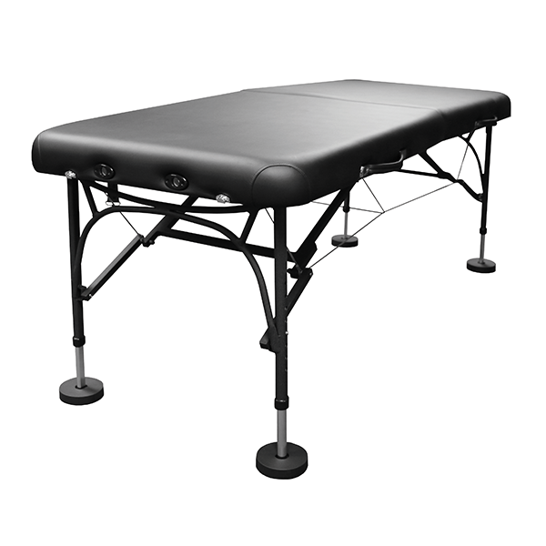 PHS Medical Portable Aluminum Treatment Table with padded surface and lightweight legs.