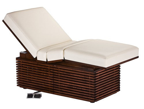 Living Earth Crafts PRO SALON electric lift table with white cushions and modern hardwood base.
