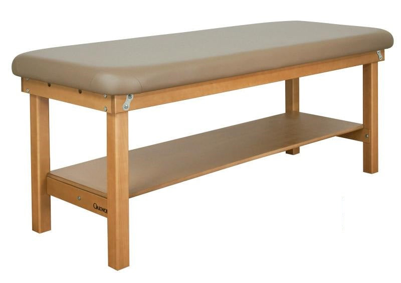 Oakworks SEYCHELLE flat top massage table with padded surface and lower storage shelf.