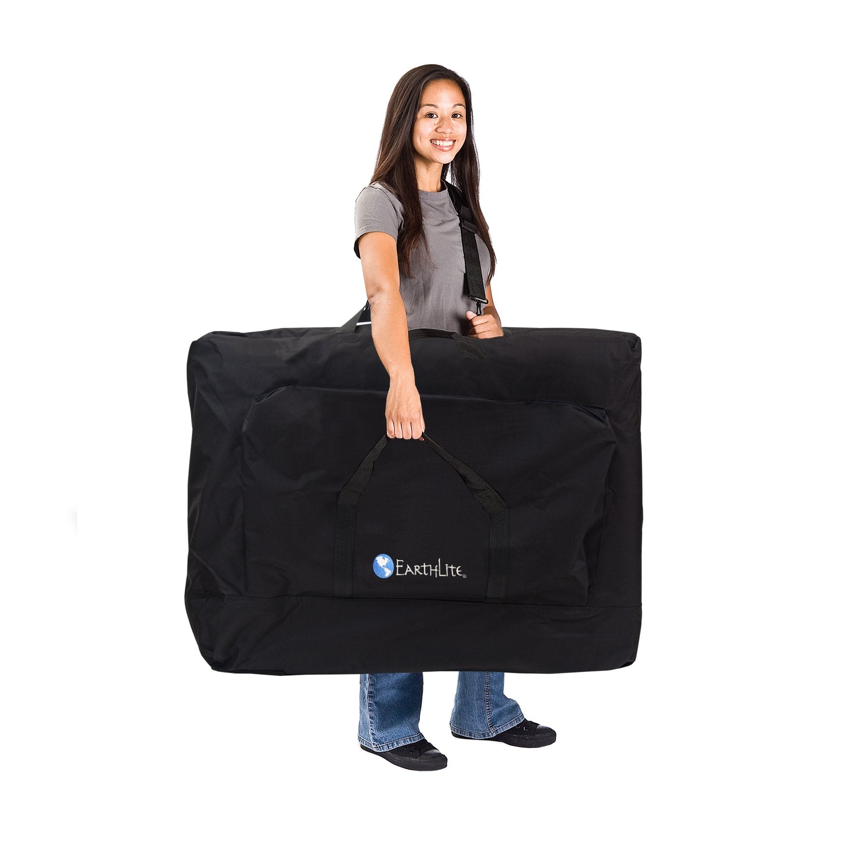 Woman holding an EarthLite SPIRIT Portable Massage Table case against a white background.