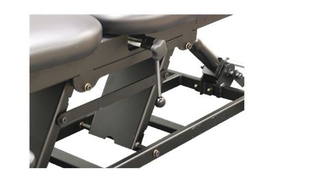 Close-up of the PHS Chiropractic ERGOBASIC table with manual pump elevation.