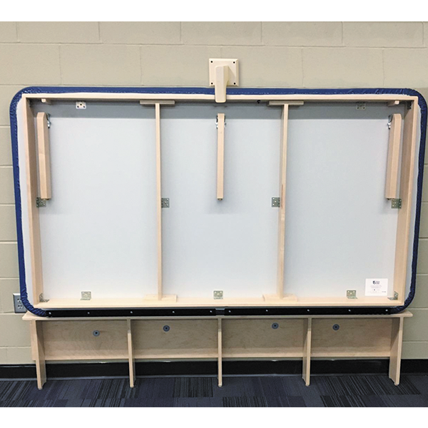 PHS Medical Wall Mount Mat Table by PHS Medical on a blue patterned floor.